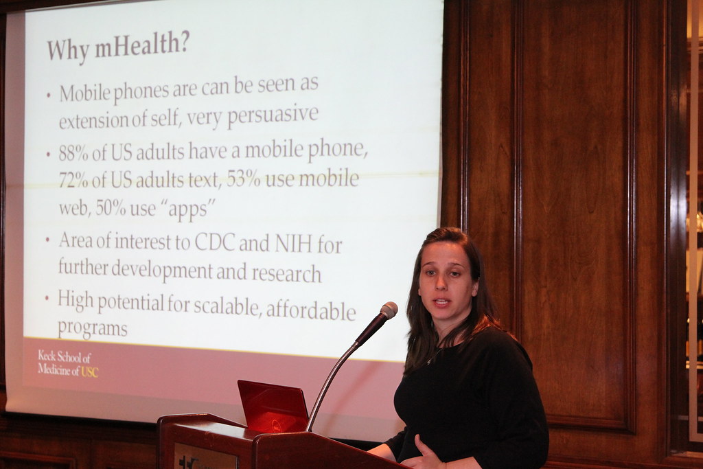 A presenter speaks at a community advisory event