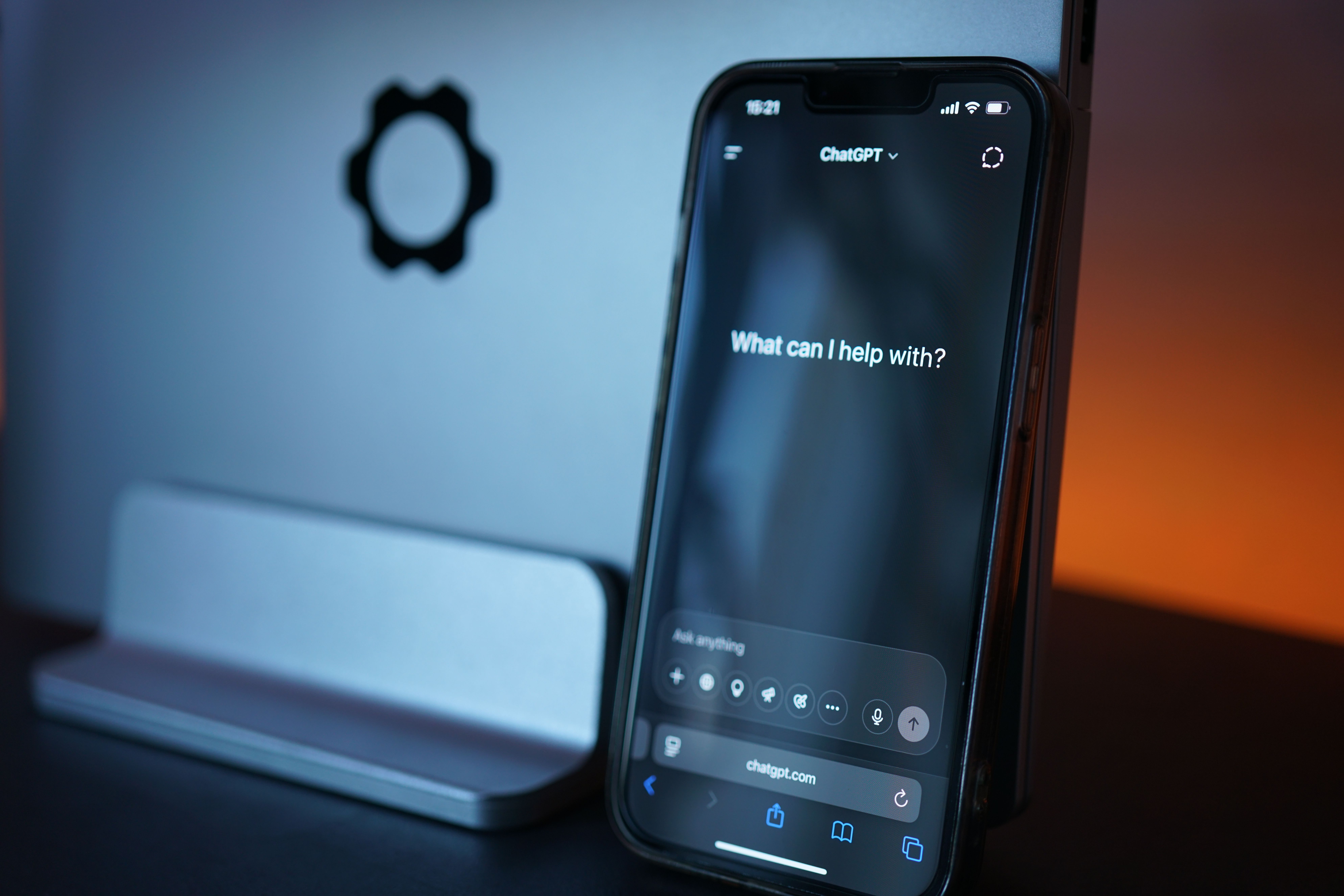 Close-up of a smartphone displaying an AI chat interface, representing typed messages converted into voice