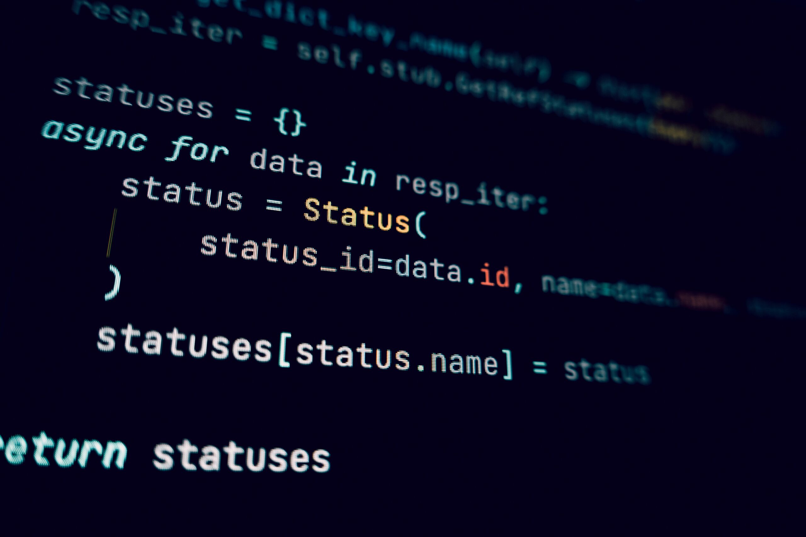 A close-up of a monitor displaying Python code for an API integration.