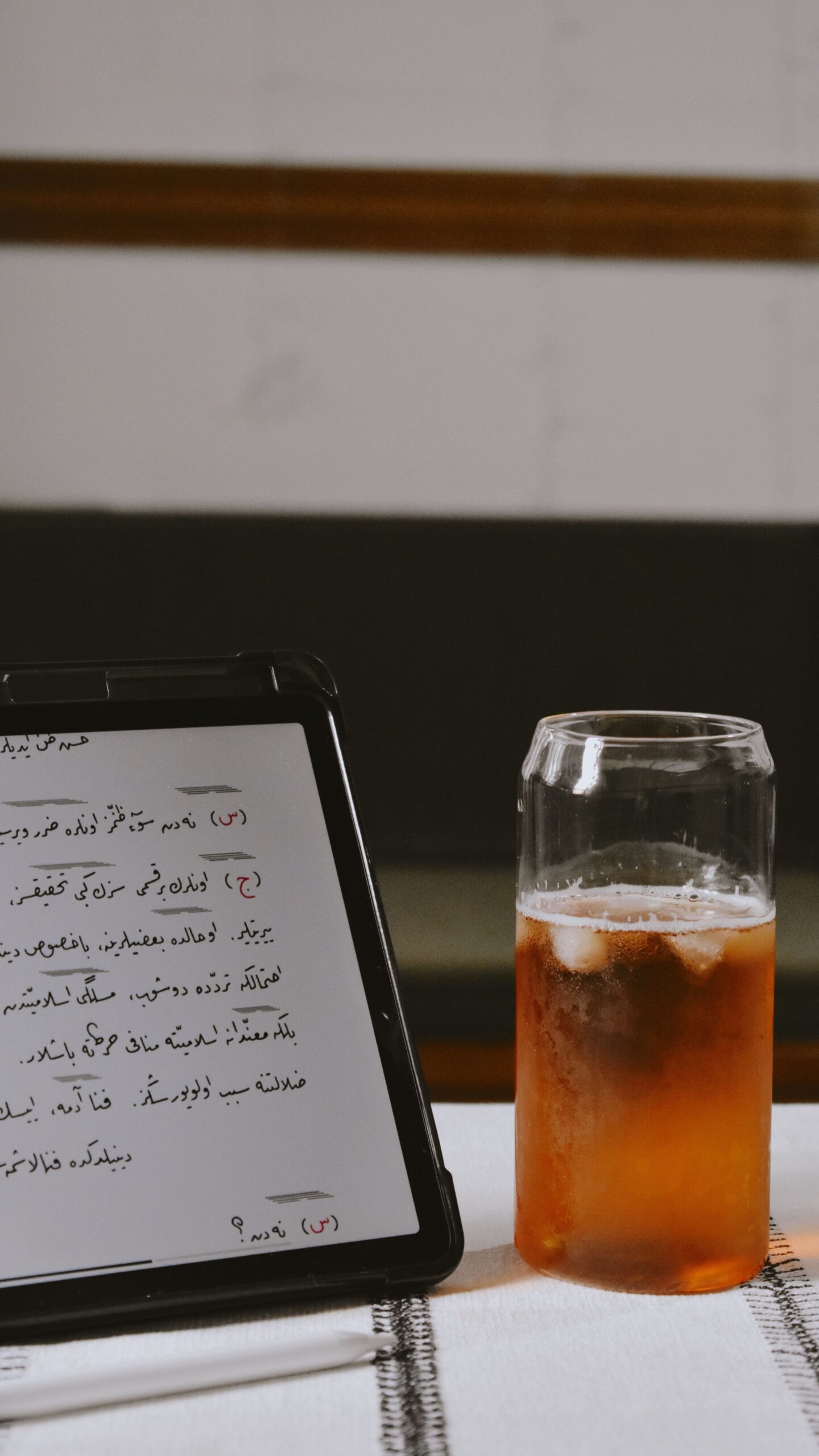 A tablet showing text in Arabic, the sort of message a reader would translate on the spot.