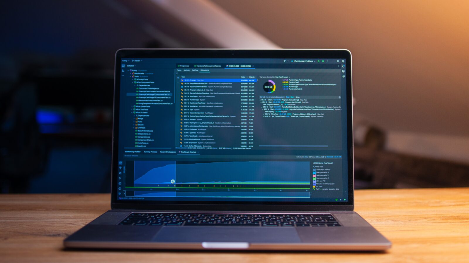 A modern laptop on a desk with code and developer tools displayed on its screen, representing building a Discord translation integration.
