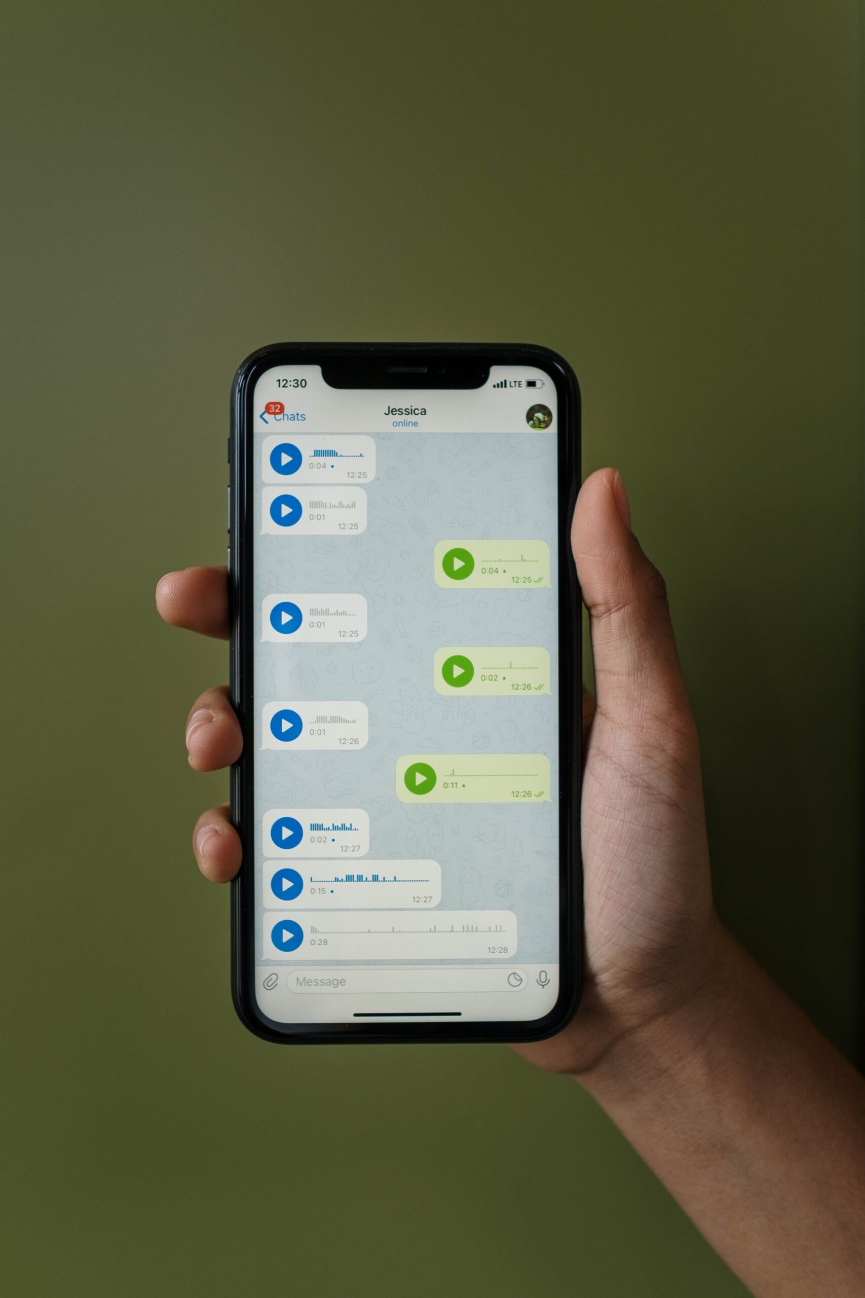 Phone screen showing a chat full of voice message bubbles with waveform icons